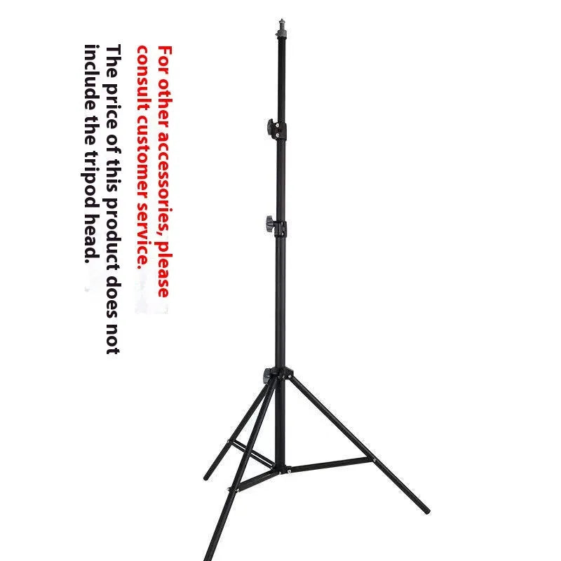A frosted finish floor tripod light stand at full height with a mobile phone holder attached.