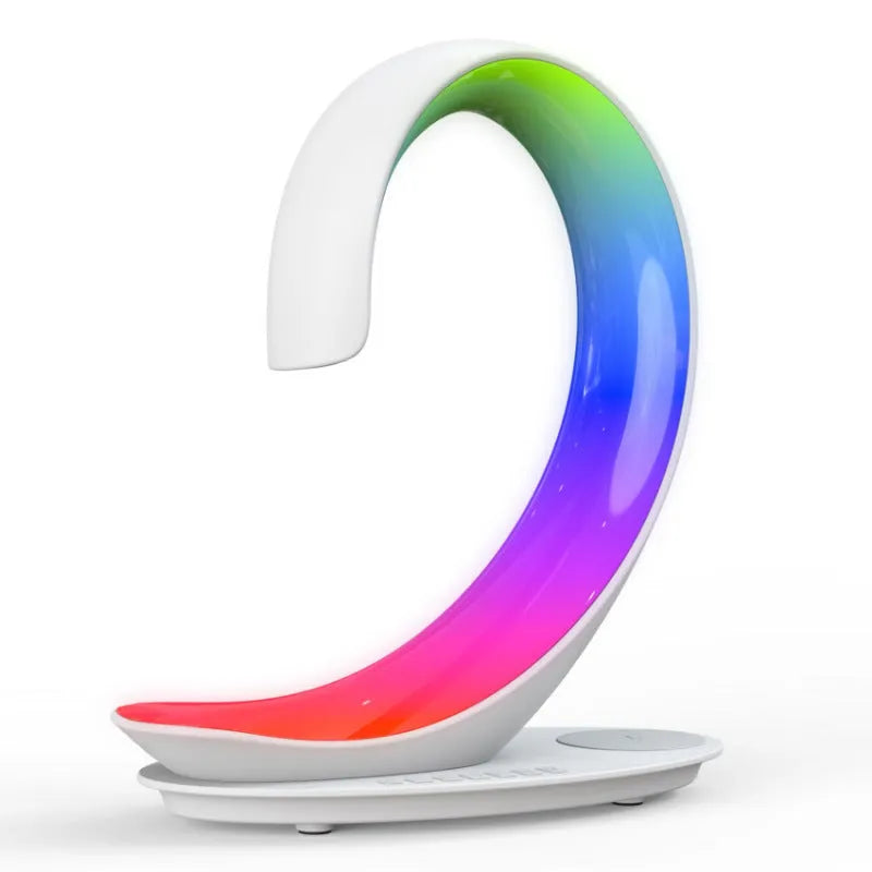 White swan-shaped desktop wireless charger with Bluetooth speaker and colourful atmosphere light