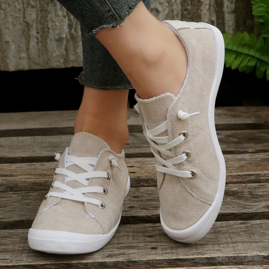 Women's creamy-white beige low-top fabric casual sneakers on a wear-resistant rubber sole.