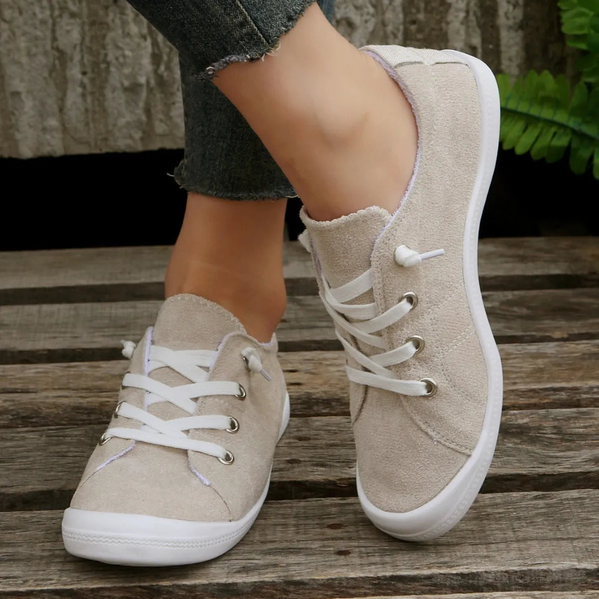 Women's creamy-white beige low-top fabric casual sneakers on a wear-resistant rubber sole.