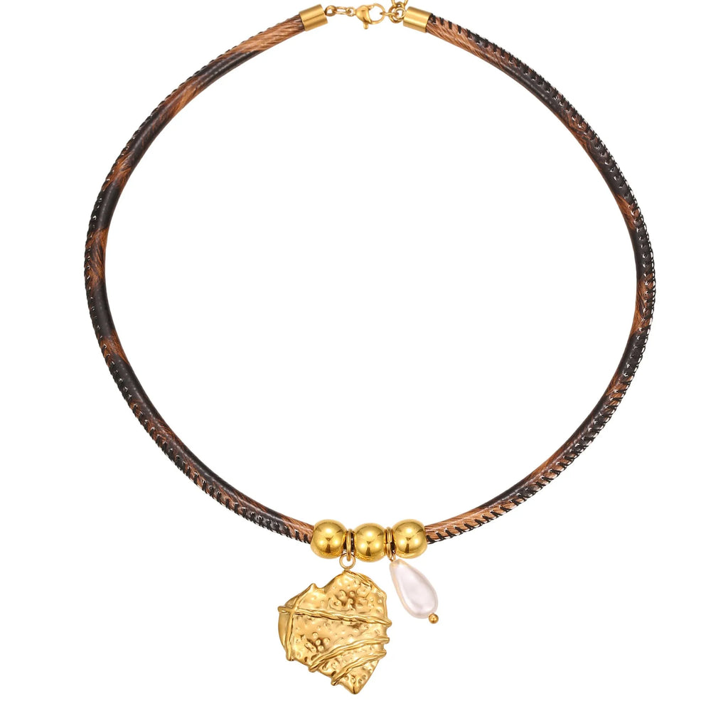 Gold plated stainless steel necklace with geometric leopard pendant and adjustable chain on white background
