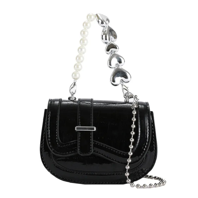 Silver square women's crossbody bag with single shoulder strap showing internal phone pocket