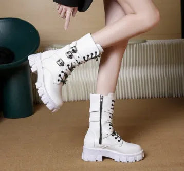 Women's black mid-calf boots with side zip and metal buckle detail on a white background.