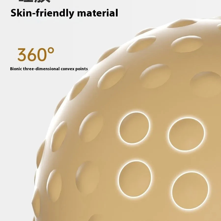 Caramel mocha coloured double massage ball set for hot and cold compress therapy on a wooden floor.