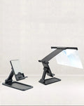 Black folding mobile phone screen amplifier with detachable holder showing 12-inch curved display