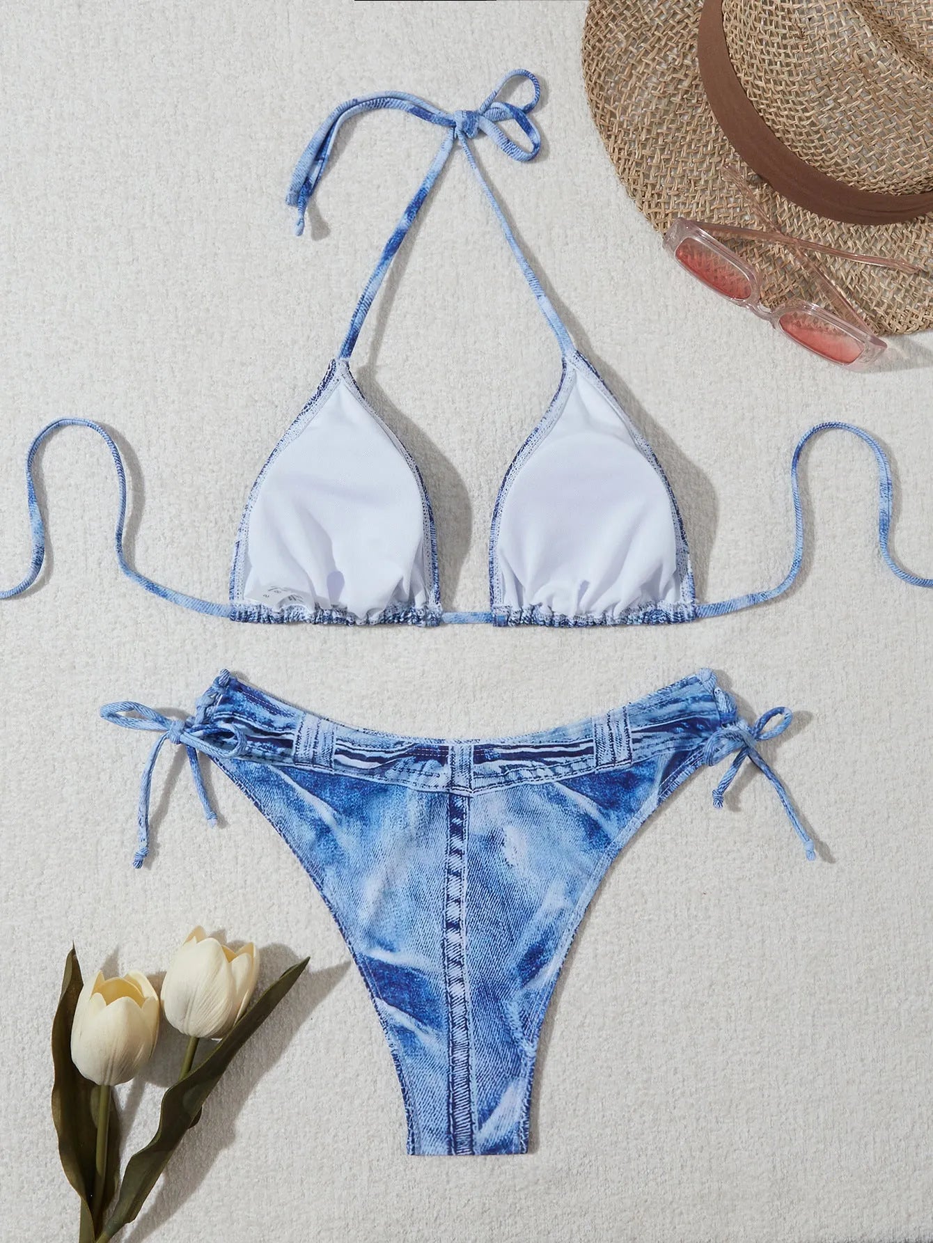 Women's denim blue printed bikini set with adjustable straps, shown as a two-piece swimsuit.