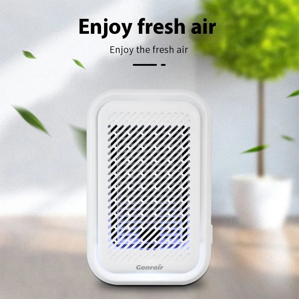 White wall-mounted plug-in air purifier unit for small rooms