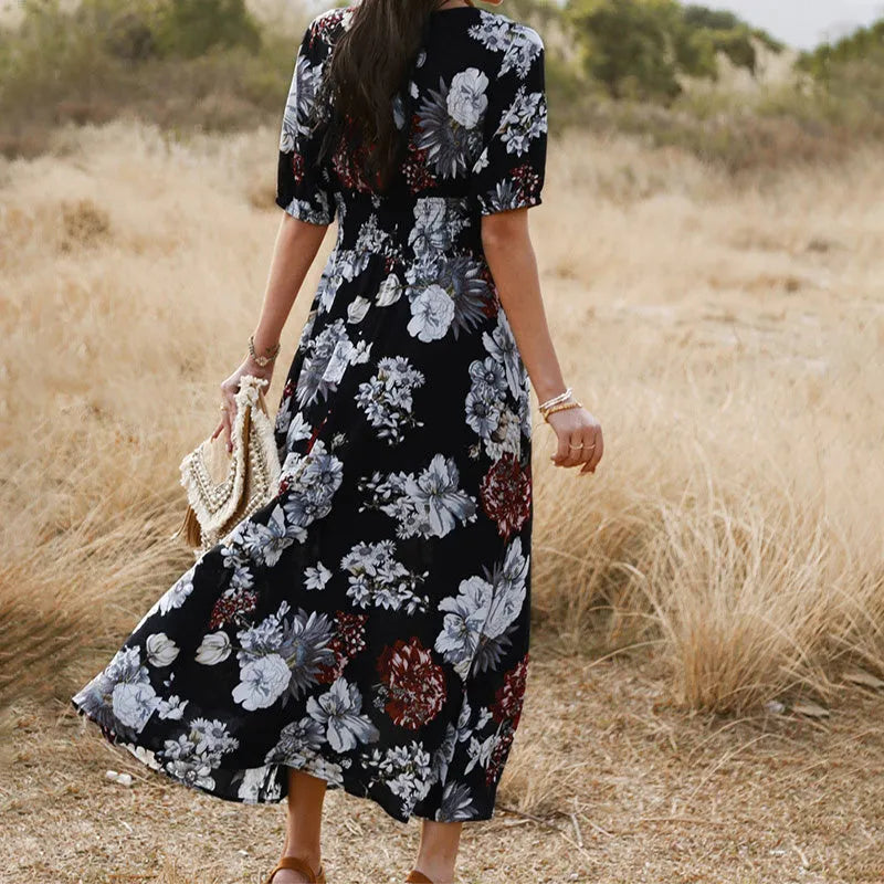 Yellow floral print women's summer dress with V-neck and elastic waist on a hanger