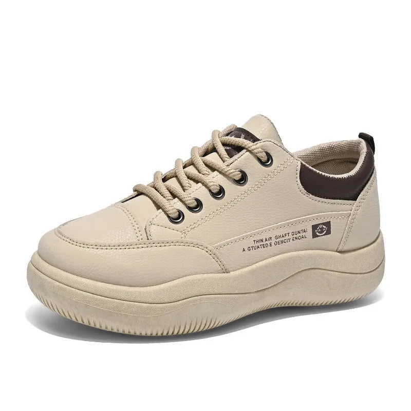 Women's white Korean-style casual shoes with cross strap detail and a synthetic leather upper.