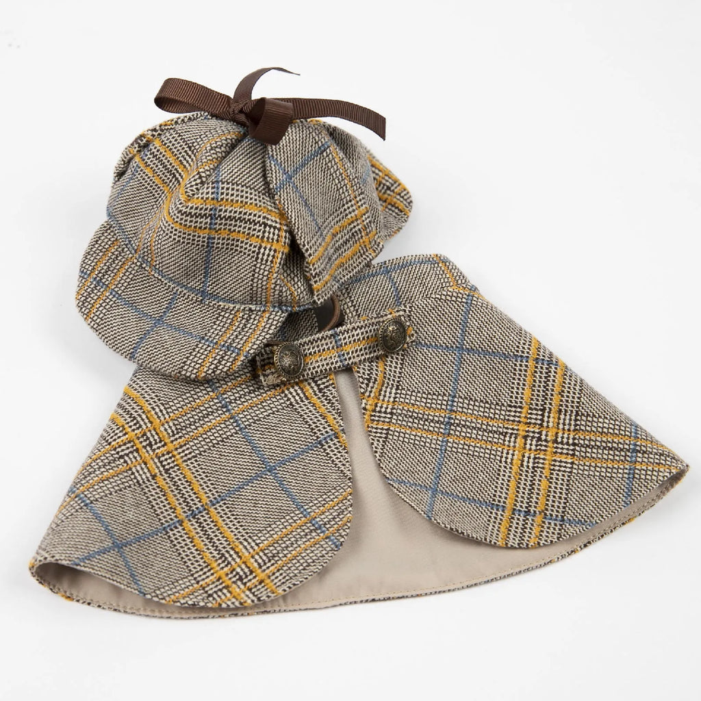 Camel-coloured cotton cloak with adjustable hat for a dog or cat, showing the cloak's style and fit.