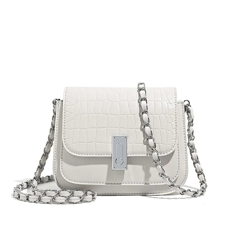 Women's black PU leather chain shoulder bag showing internal phone compartment and sewing thread detailing