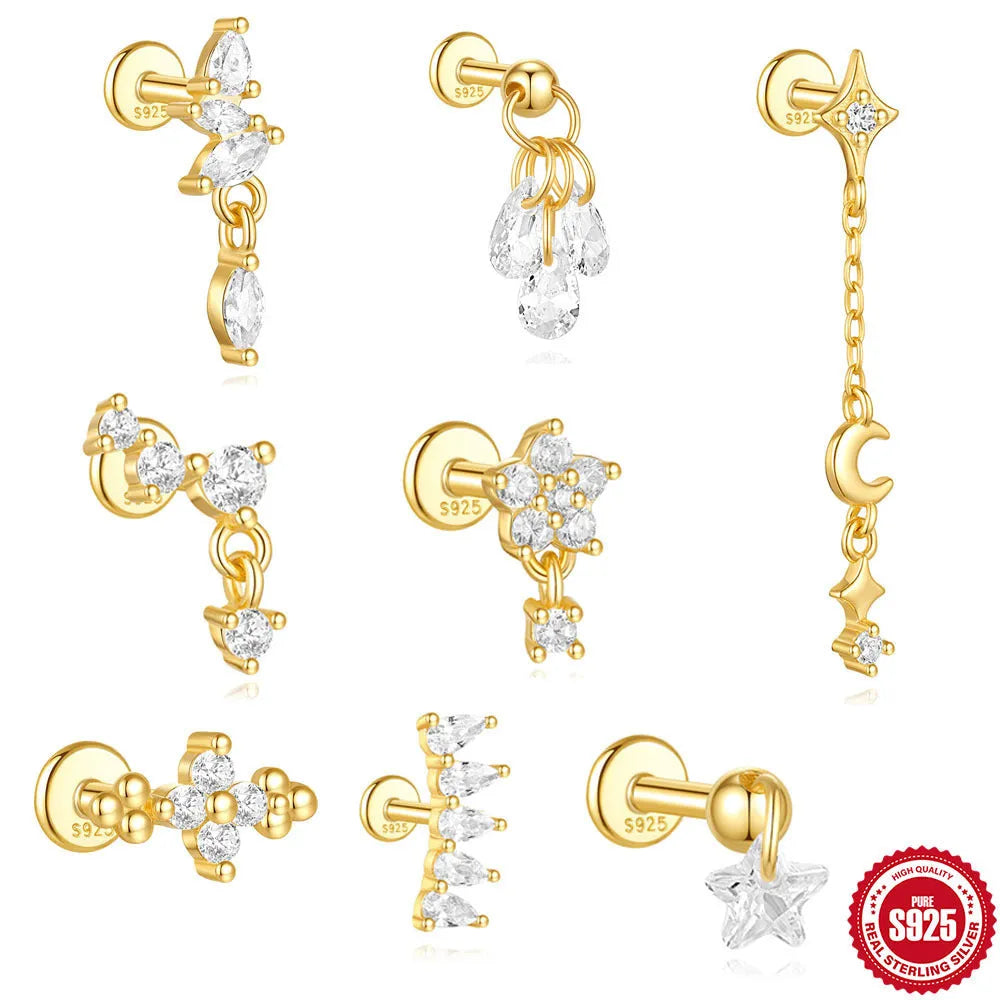 S925 sterling silver geometric moon and embedded star piercing earrings on a gold-colour background.