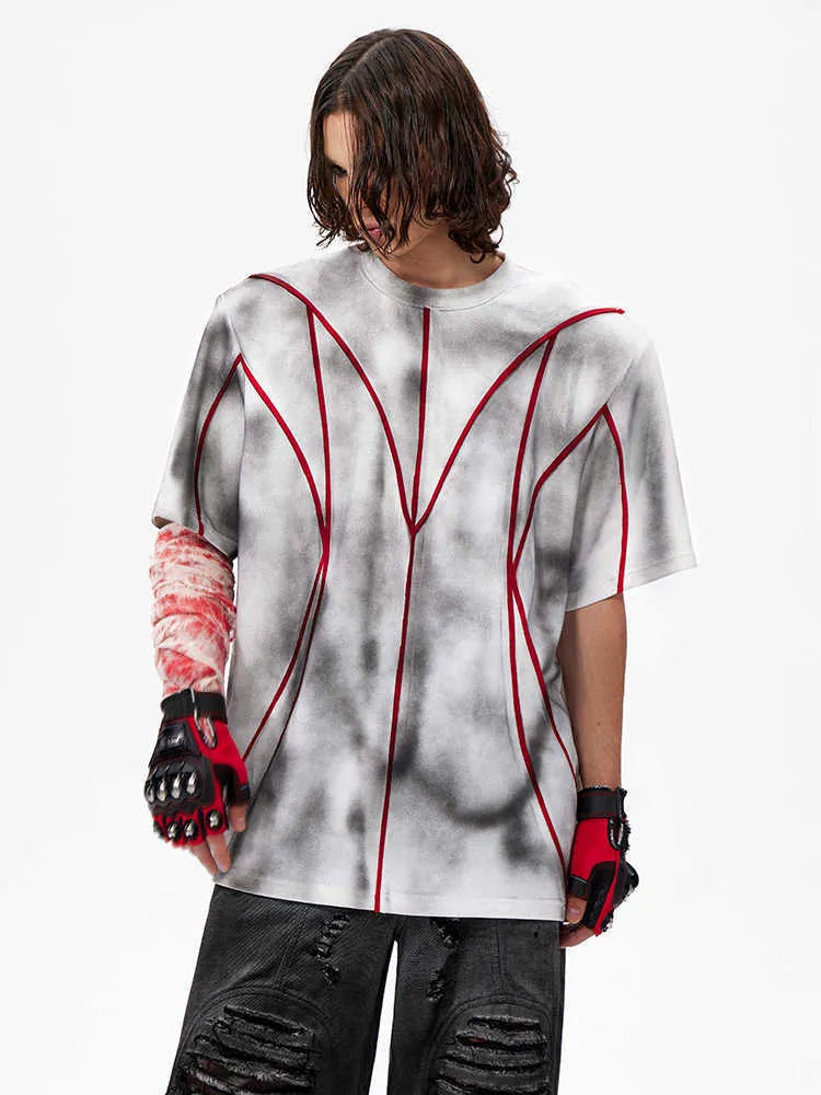 Women's short sleeve T-shirt with padded shoulders and textured 3D line patchwork detail on a round neck top.