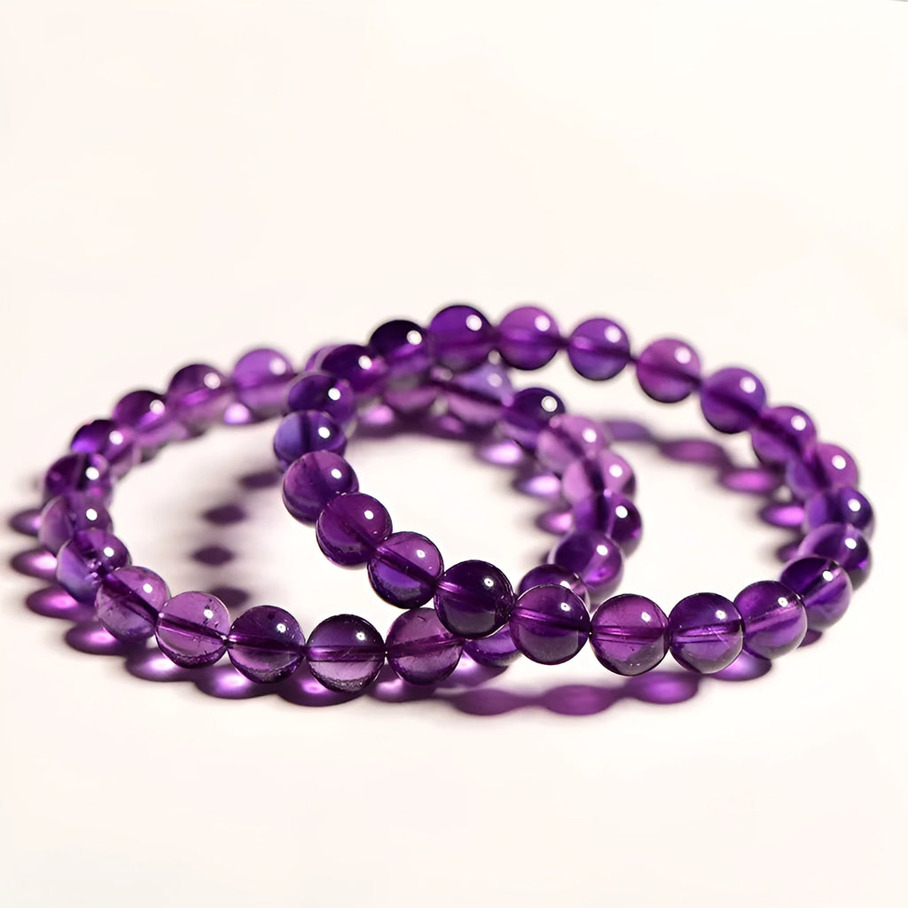 Natural amethyst scattered bead bracelet made from polished Uruguayan crystal in various sizes.