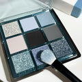 MUGELEEN nine-colour eye shadow palette 08 showing low saturation blue and earth tones with matte shimmer finishes