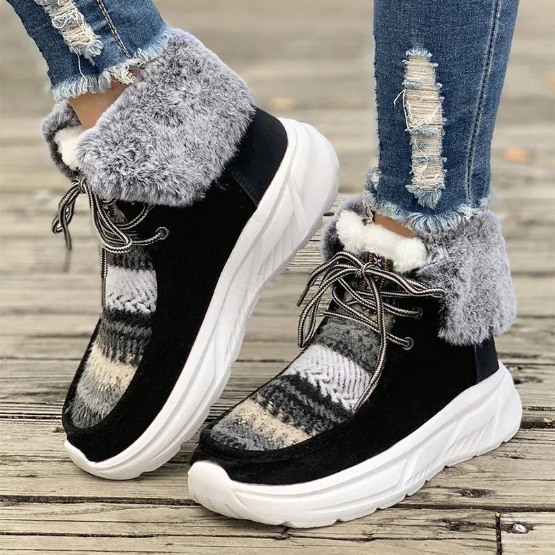 Women's beige lace-up snow boots showing front tie design and mid-top height with plush lining