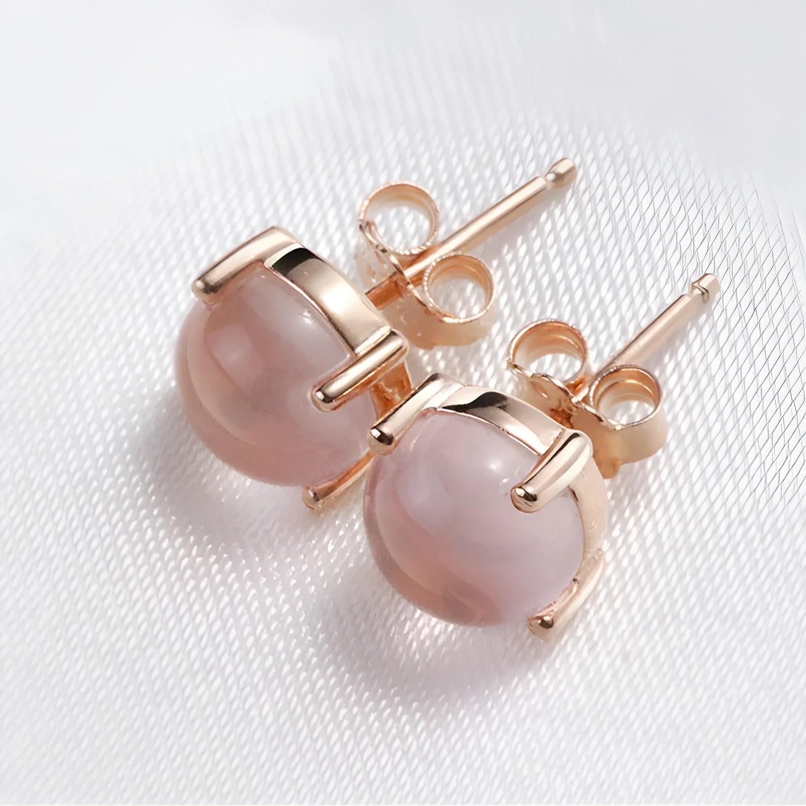 Women's rose gold drop earrings with synthetic rose quartz crystal inlay, Korean-style design