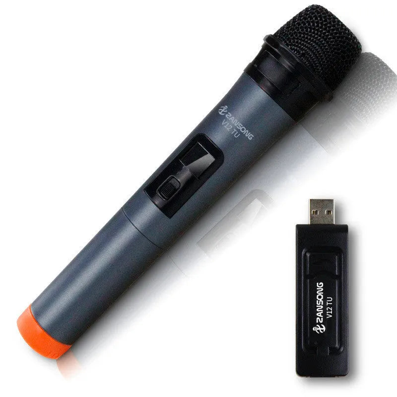 Black ZANSONG V12 dynamic wireless microphone with USB receiver and cables on a table.