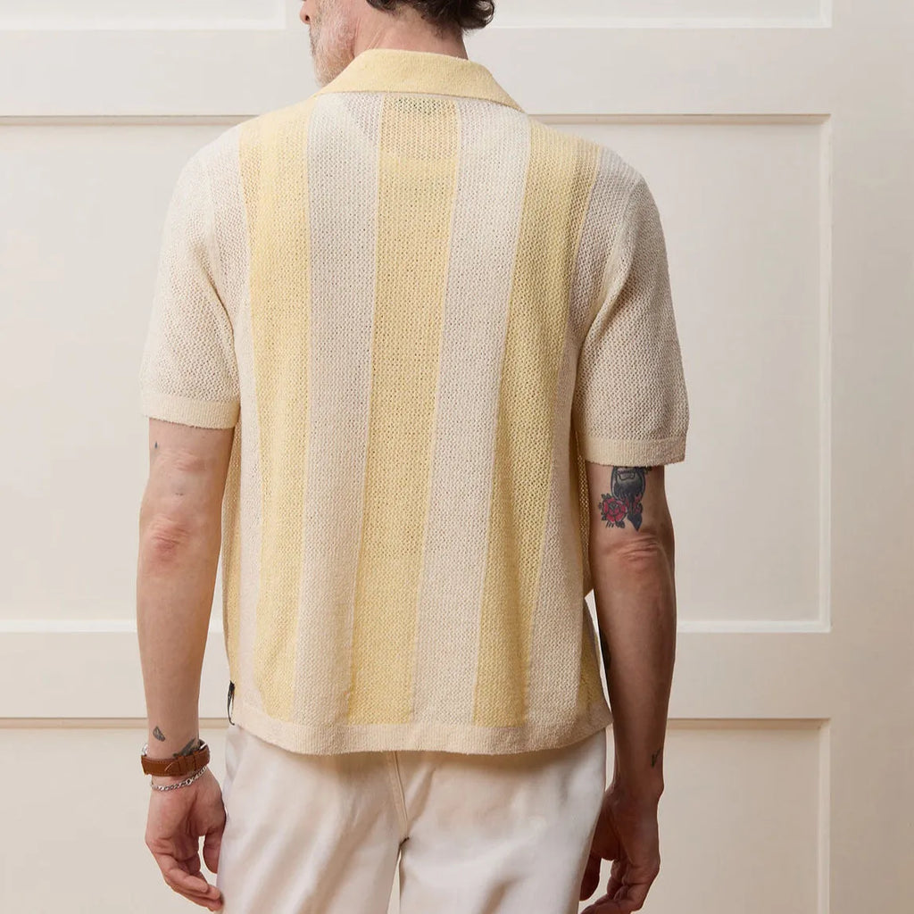 Yellow men's polo shirt with hollow-out knit design and asymmetric details in Tencel fabric