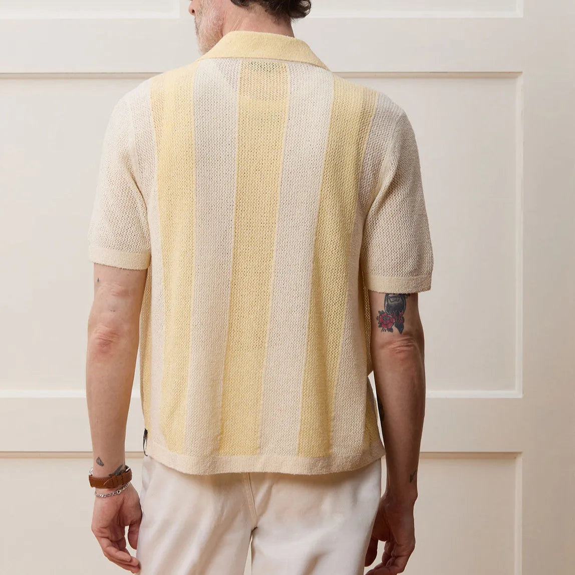 Yellow men's polo shirt with hollow-out knit design and asymmetric details in Tencel fabric