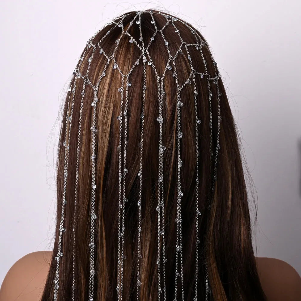 Gold mesh rhinestone headband with tassel detail showing electroplated finish and decorative elements