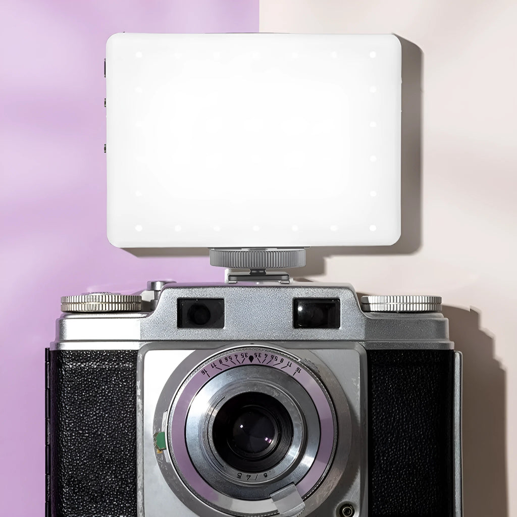 Portable LED fill light clipped onto mobile phone for photography and live streaming