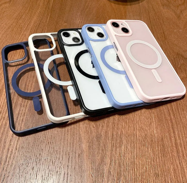 Transparent acrylic MagSafe phone case for iPhone on a table, showing magnetic ring and clear back.
