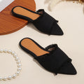 Women's denim flat slippers with tassel detail in multiple colour options.