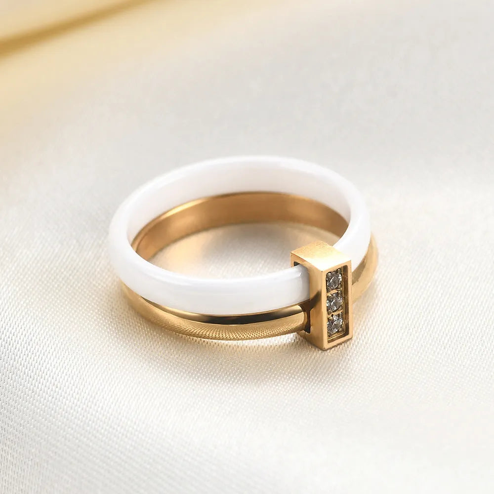 Glossy ceramic women's ring with geometric shape and stitching detail in steel black or gold white finish