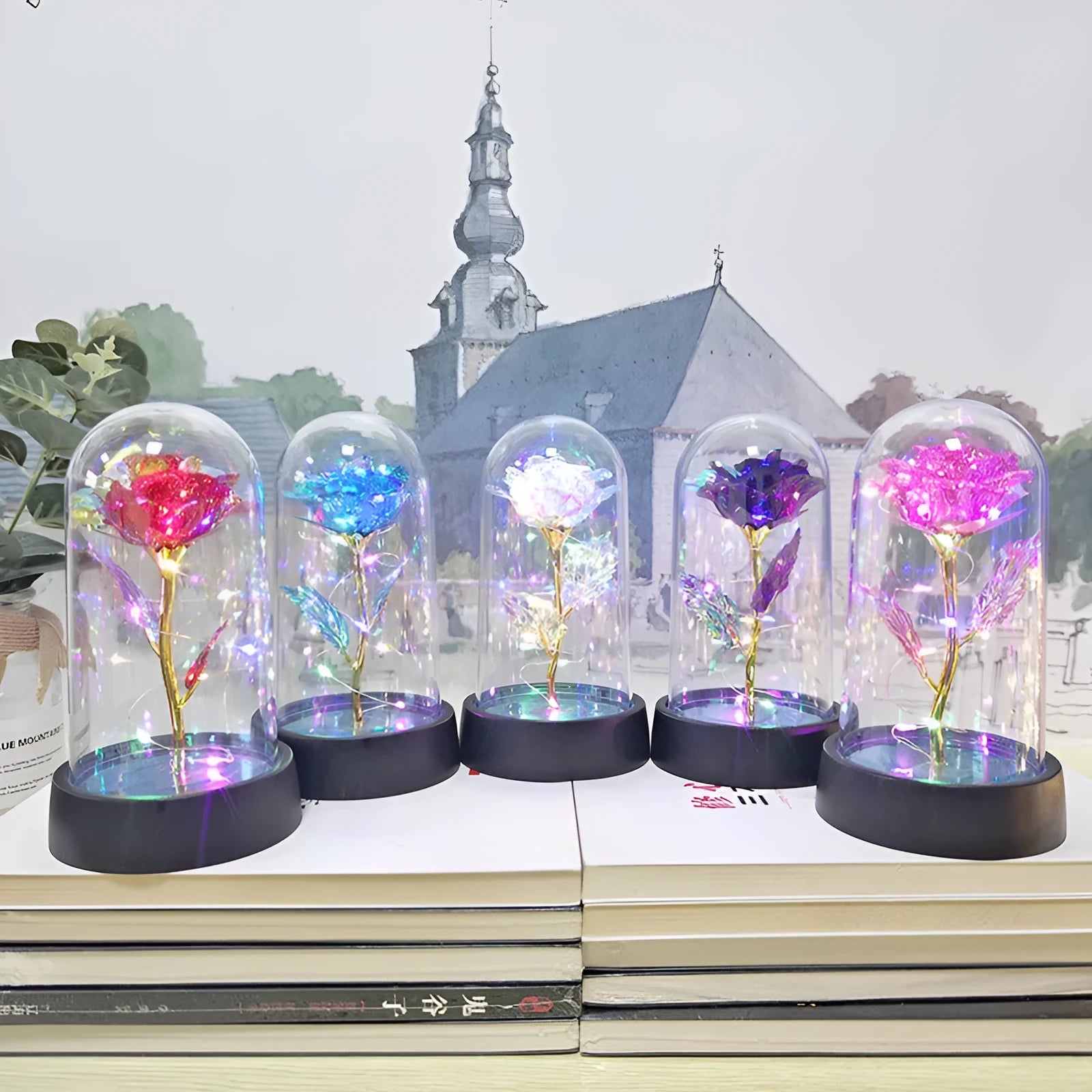 Small decorative night lamp with a glass cover and plastic flowers on a black base.