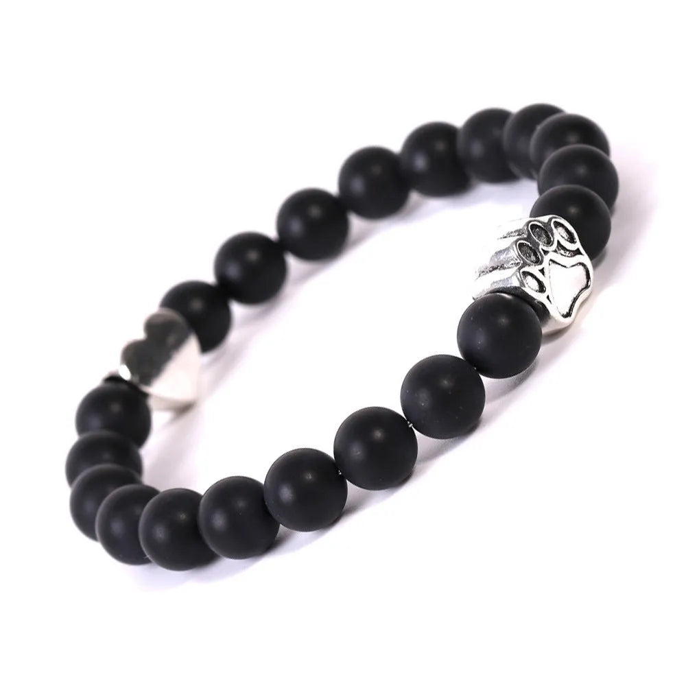 Tigereye Indian agate bracelet with geometric heart charm and dog's paw motifs on wrist