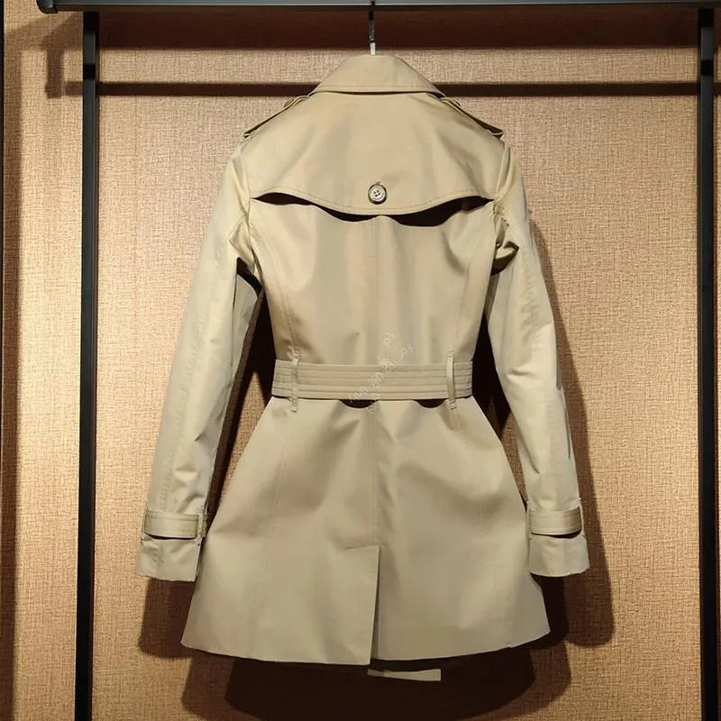 Khaki women's trench coat with double-breasted British styling and flight sleeves