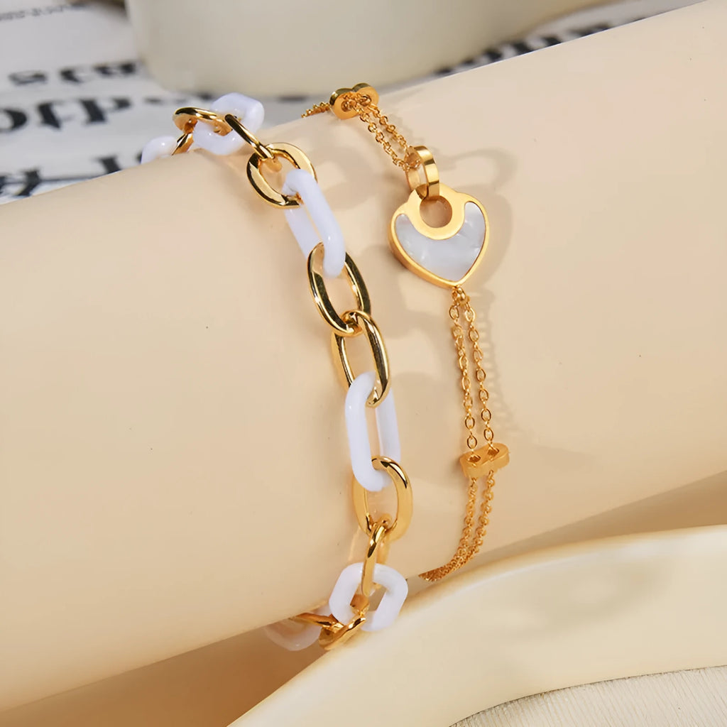 Stainless steel and resin bracelet for women with a double-layered heart-shaped charm.