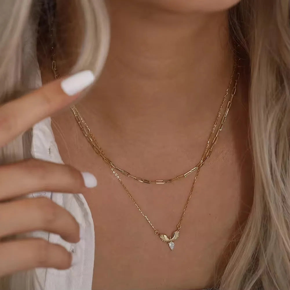 Women's silver eagle pendant necklace with adjustable O-ring chain in white gold or yellow gold finish