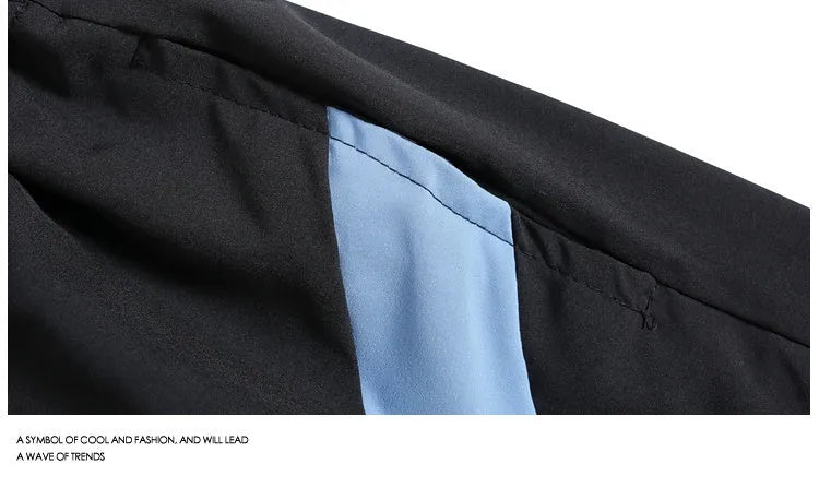 Man wearing black loose-fitting quick-dry training shorts with an elastic waist, suitable for sports and casual wear.