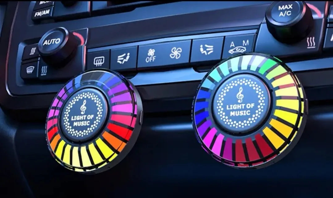 Car air vent aromatherapy diffuser with multicolour RGB lighting mounted in vehicle vent