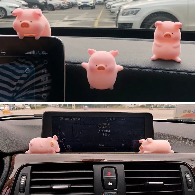 Colourful 3D resin cartoon pig figurine car decoration on a car dashboard