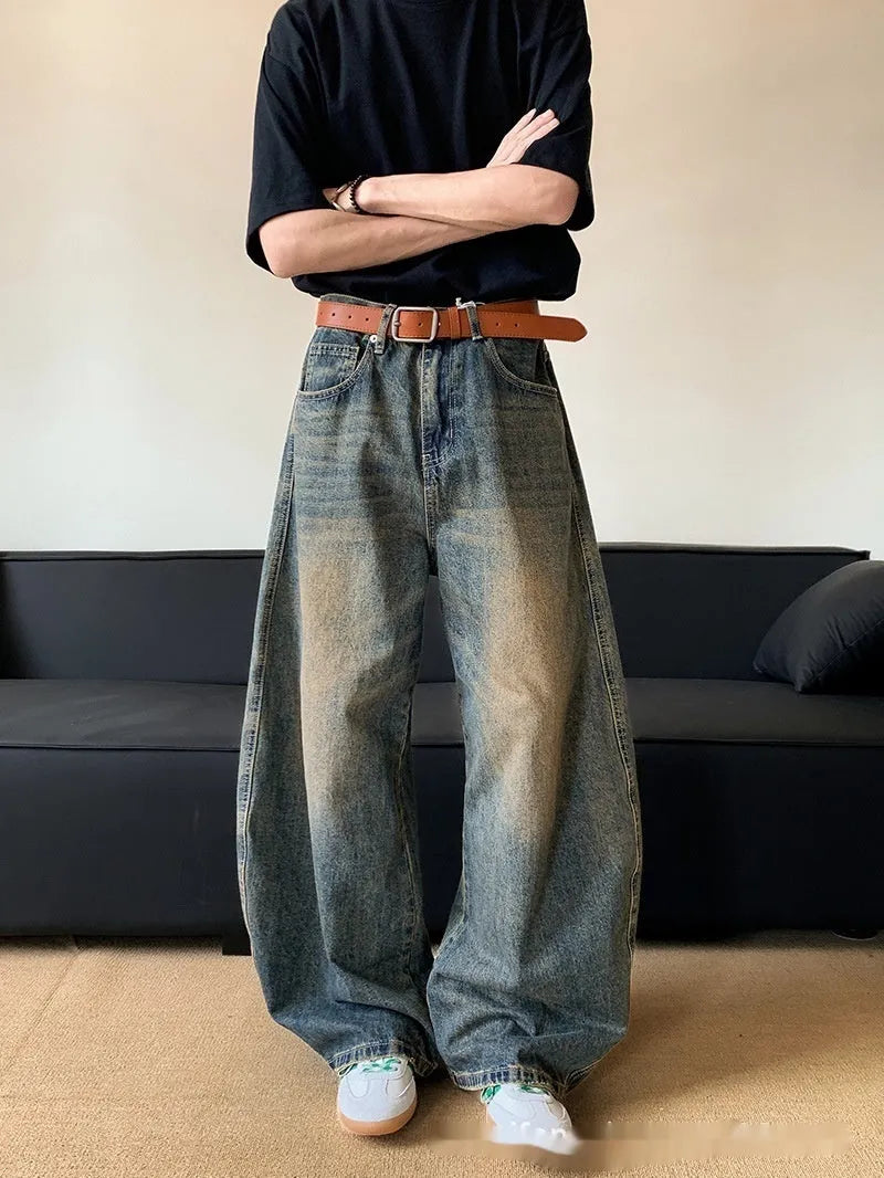 Men's retro blue distressed jeans with machete wash pattern and wide-leg design