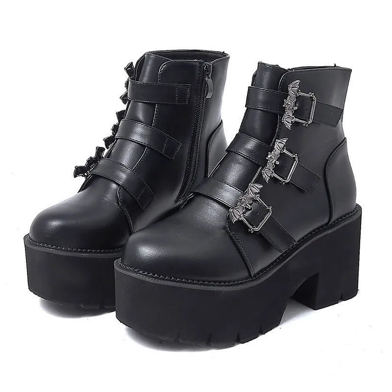 Black women's punk style Martin boots with bat buckle and side zip closure