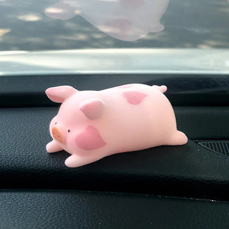 Colourful 3D resin cartoon pig figurine car decoration on a car dashboard