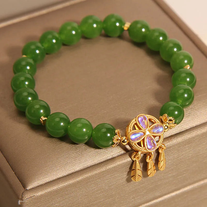 Green jasper crystal bracelet for women with four-leaf clover dream catcher pendant.