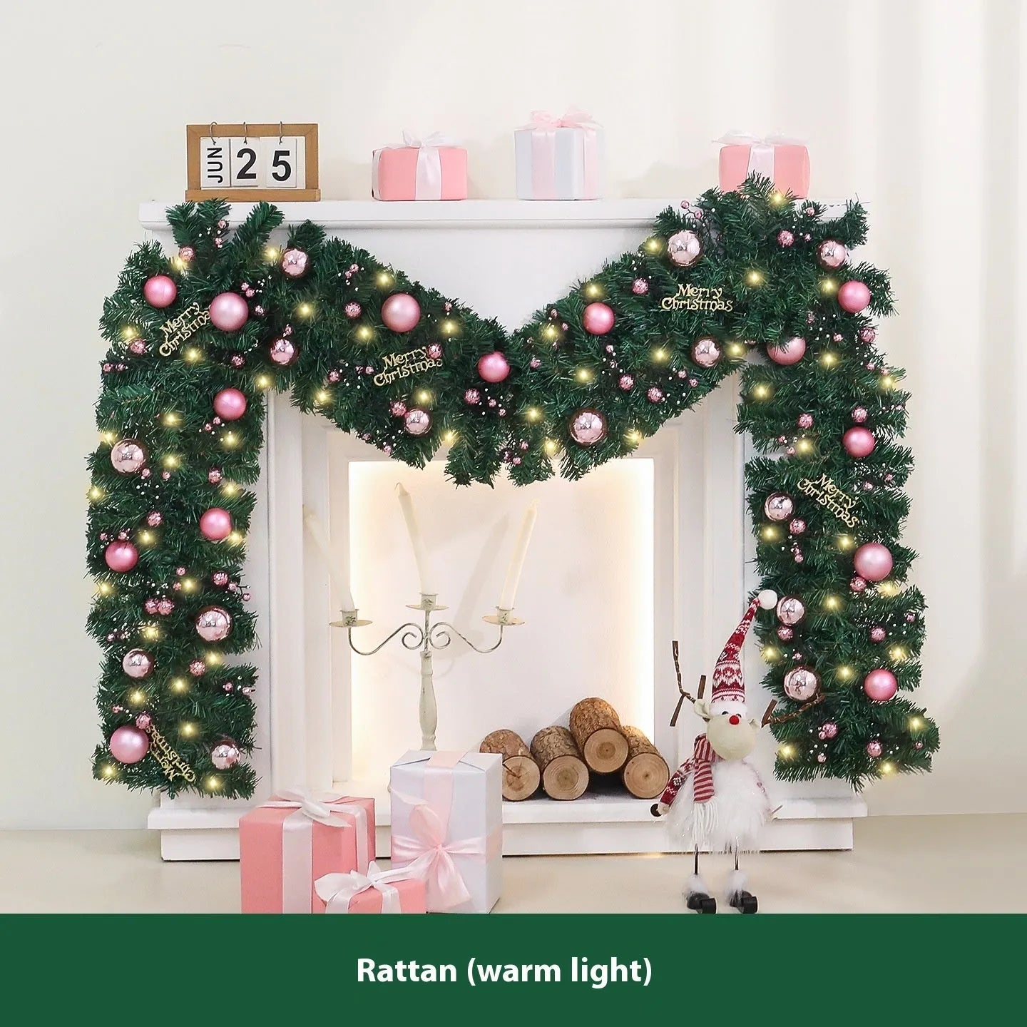 Pink artificial Christmas rattan garland with small berries and warm white LED lights draped on a mantelpiece.