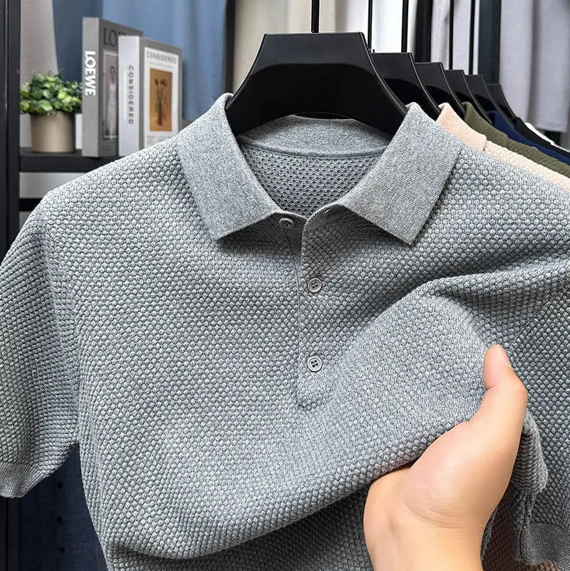 Men's loose fit grey cotton short sleeve pullover sweater on a hanger