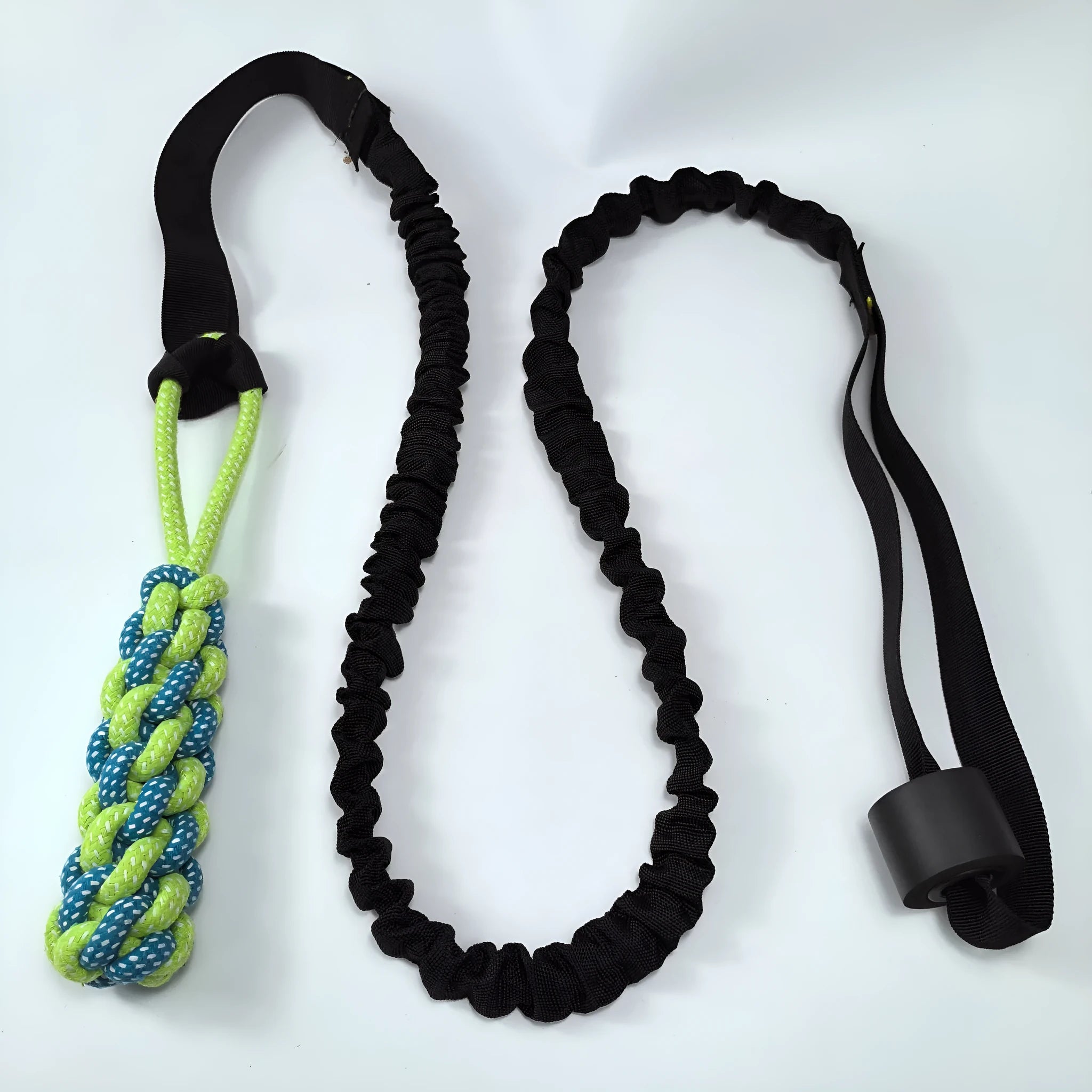 Green cotton rope dog toy with ball for tug of war and fetch games.