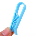A white PP plastic non-slip clip designed to secure a garbage bag to the side of a trash can.
