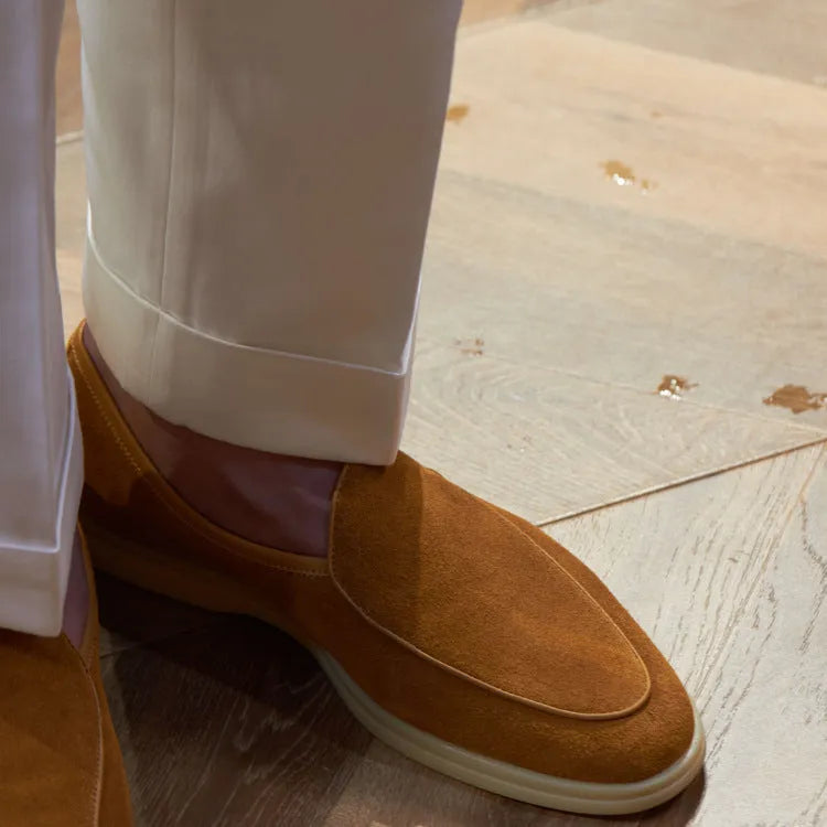 Men's handmade brown leather loafers with a low cut and textured TPR sole.