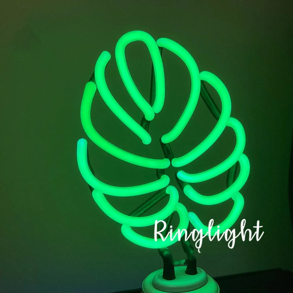 White tube bamboo shape desktop lamp emitting green light with USB cable