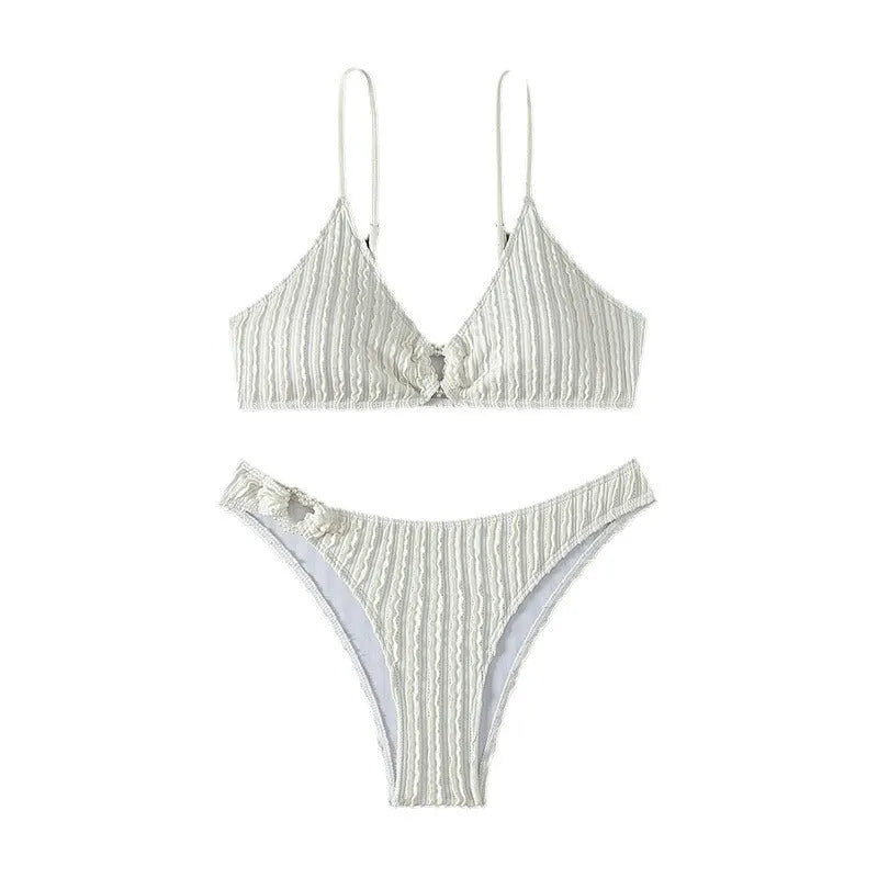 White women's V-neck swimsuit set with matching shorts on hanger