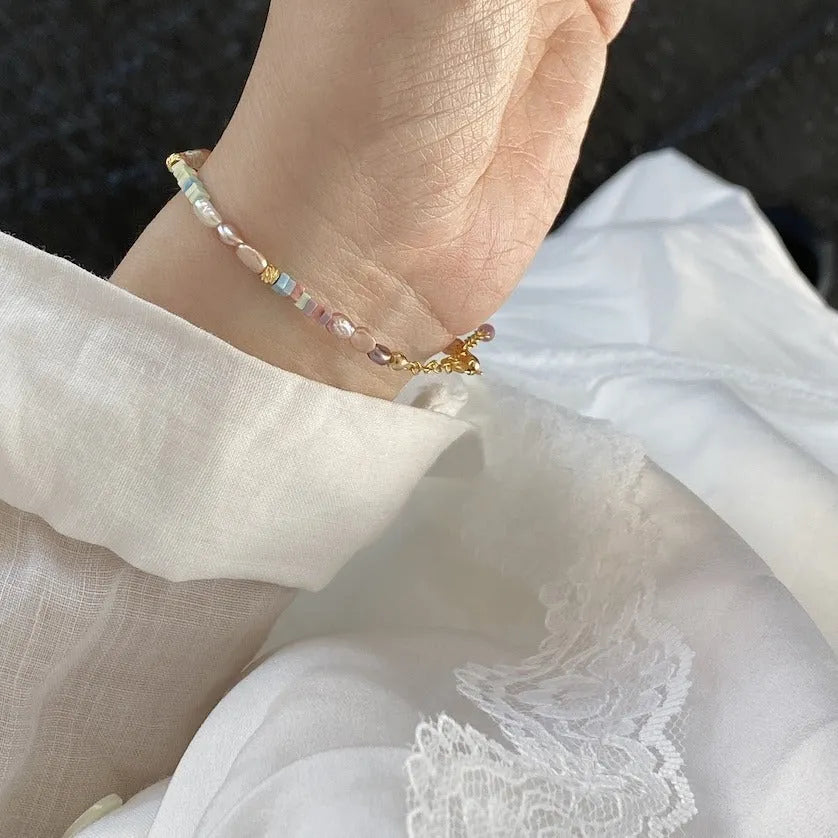 Women's natural pearl bracelet and necklace set with 14K gilded purple silver pieces and irregular U-shaped pearls.