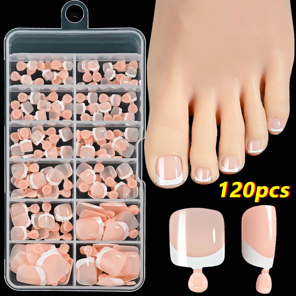 Open box showing 120 French style toe nail pieces with white tips in various nude colours.